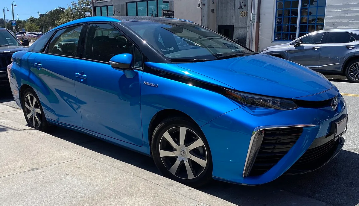 A blue first-generation 2017 Toyota Mirai parked on a street in Monterey, California