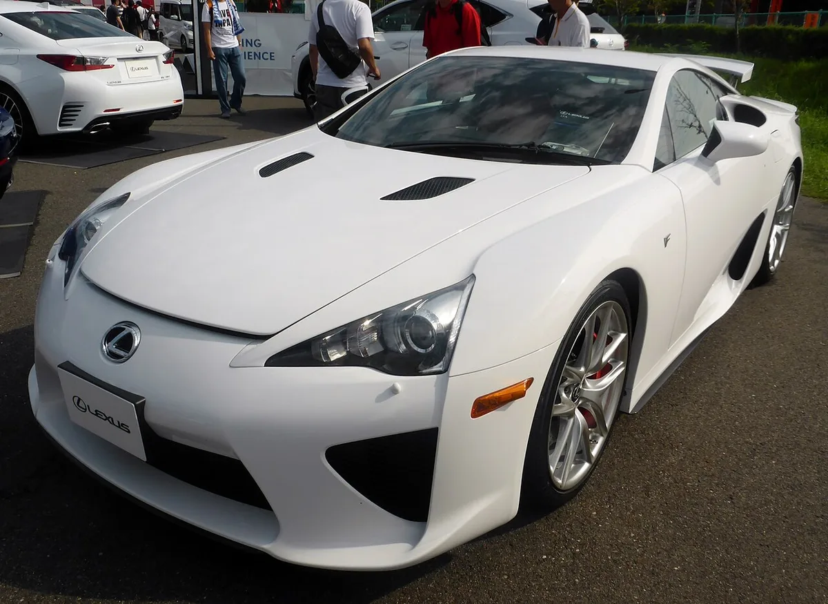 A white original Lexus LFA from the front three-quarter view, parked on pavement