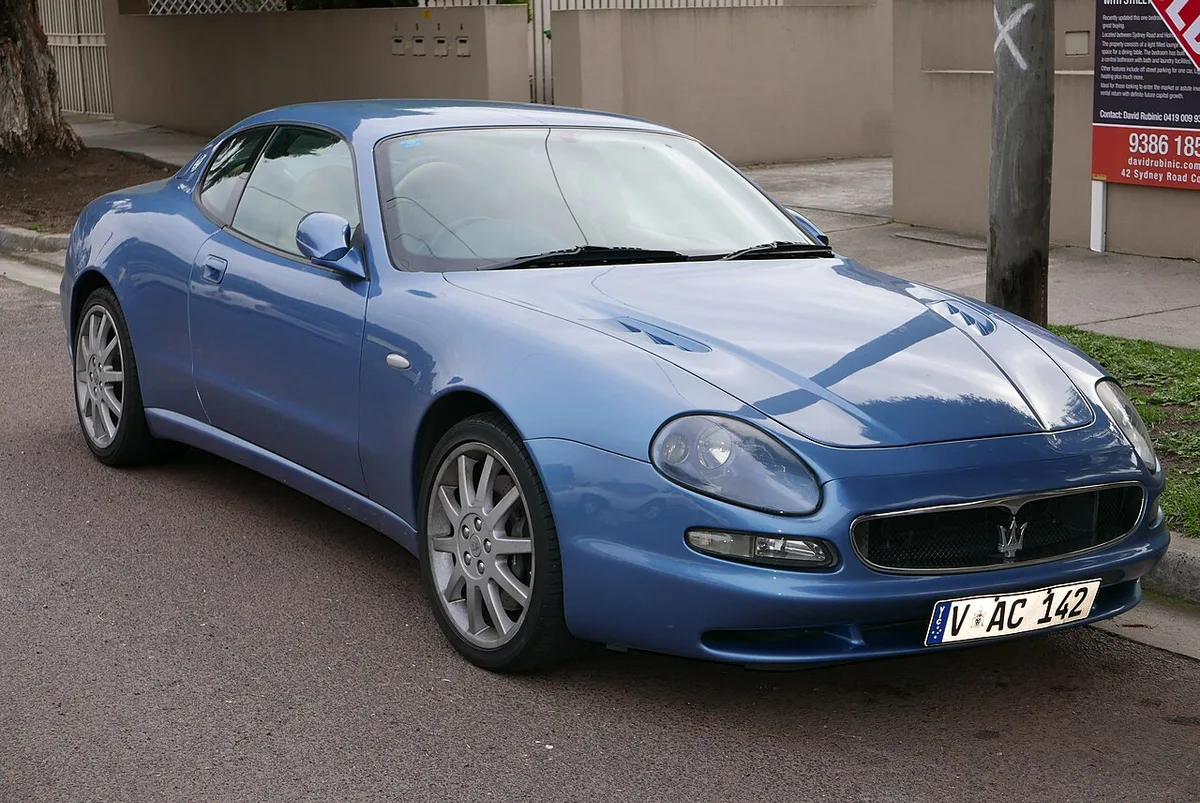 A blue 2001 Maserati 3200 GT coupe from the front three-quarter view