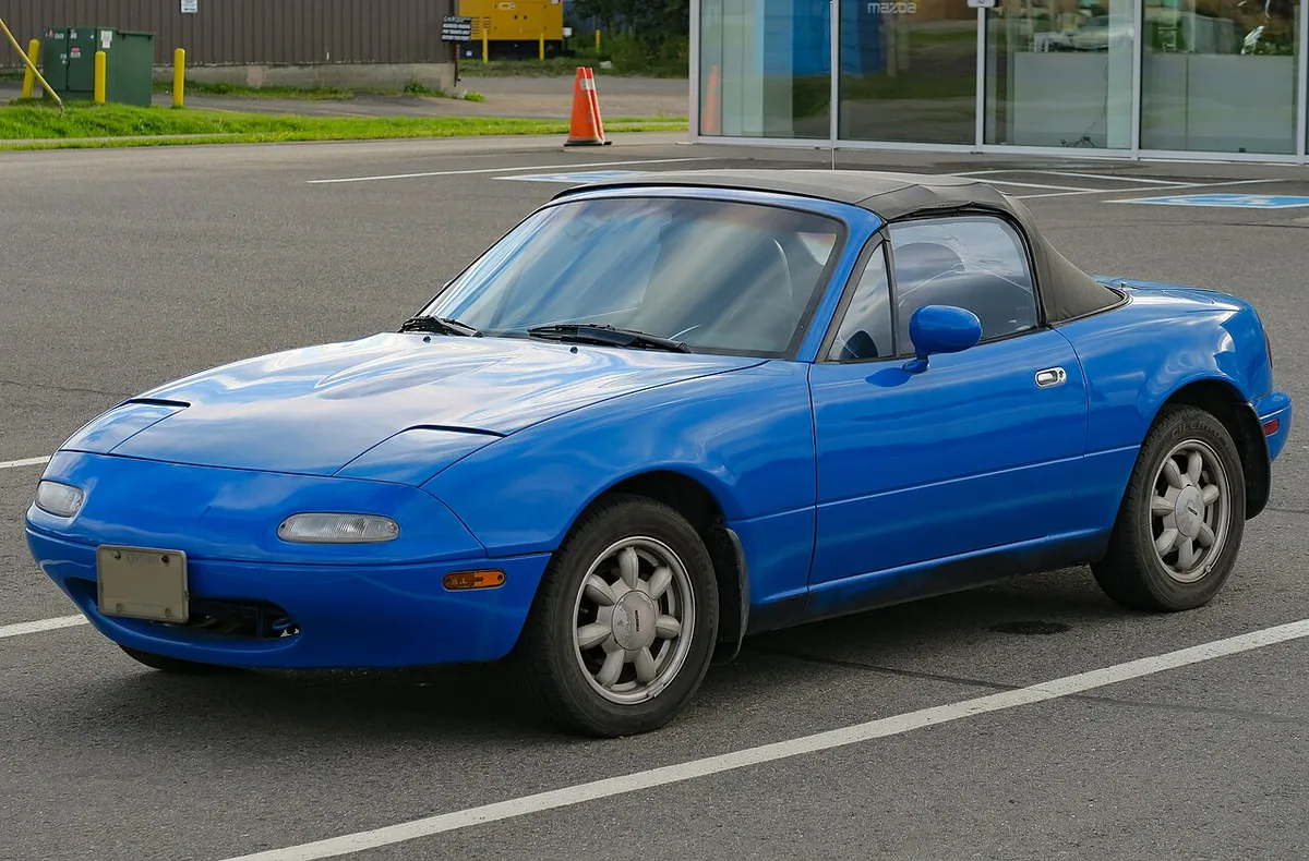 A 1990 Mazda MX-5 Miata in Mariner Blue