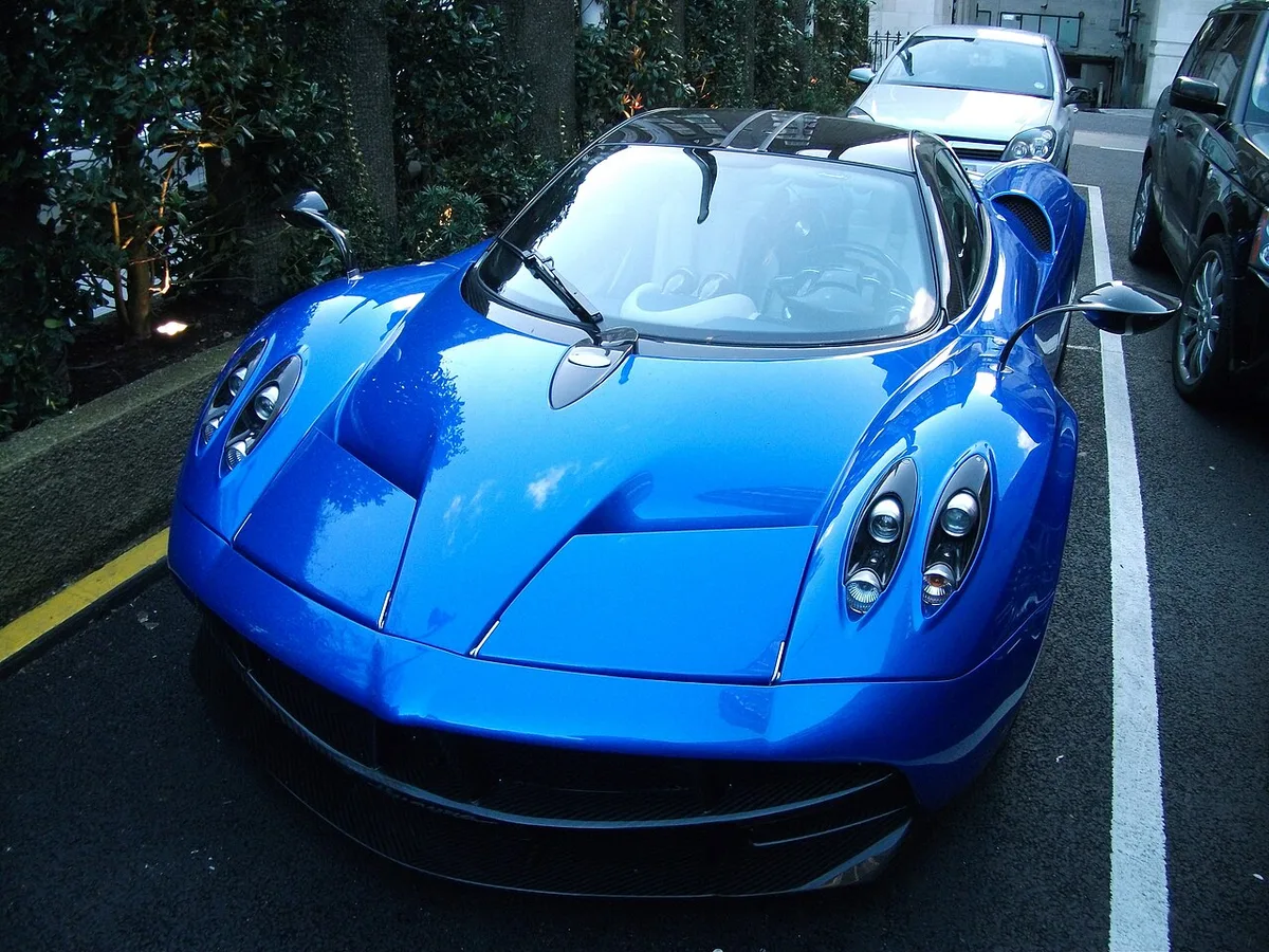 A blue Pagani Huayra coupe from the front