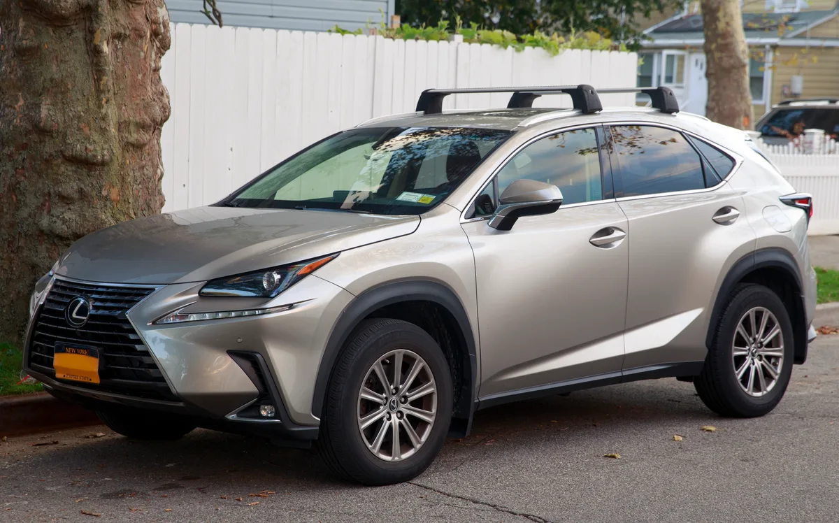 A 2019 Lexus NX 300 in Atomic Silver Metallic paint showing highlights along its body creases