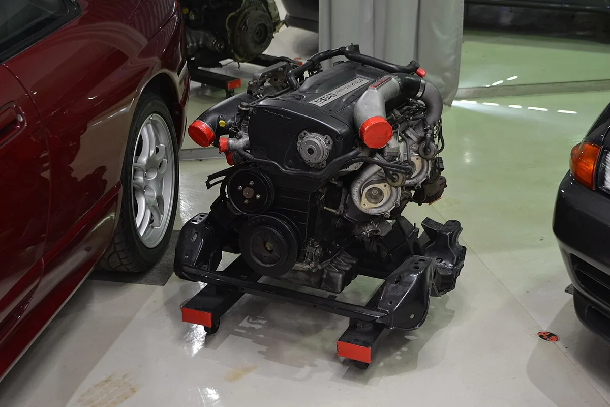 A Nissan RB26DETT engine on display at a museum
