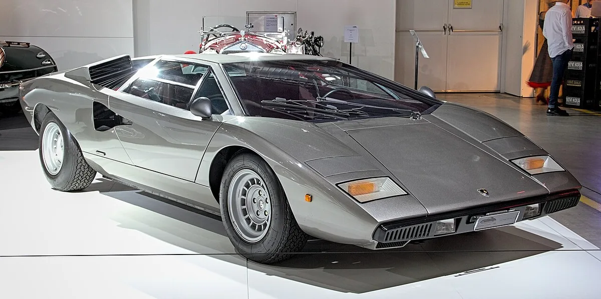 A silver 1976 Lamborghini Countach LP400 Periscopio with its flat wedge nose and angular body creases