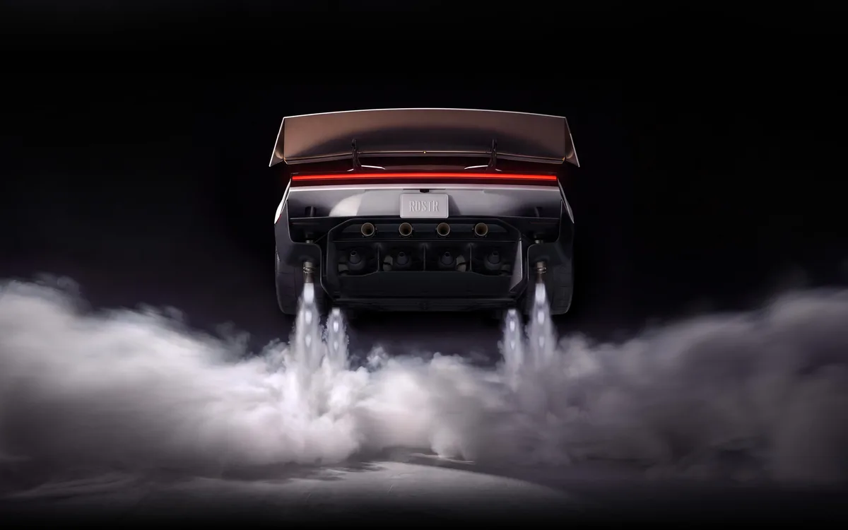 The rear of the new Tesla Roadster with four cold-gas thrusters firing white plumes onto the ground