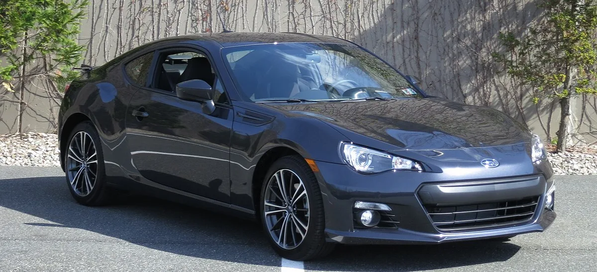 A dark gray 2013 Subaru BRZ from the front three-quarter view