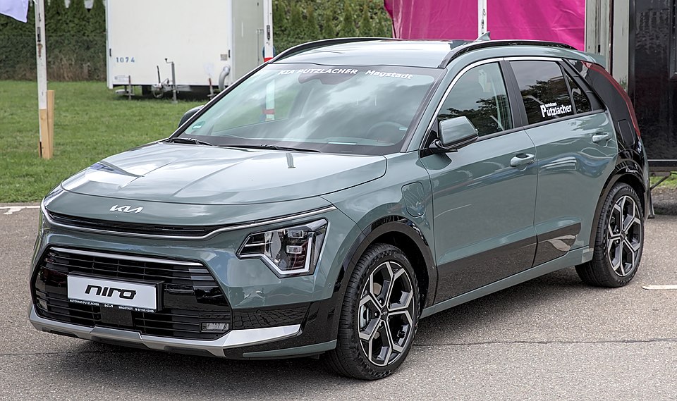 Kia Niro: Efficiency-focused crossover. Hybrid, plug-in hybrid, and full-electric Niro EV. A green small SUV.